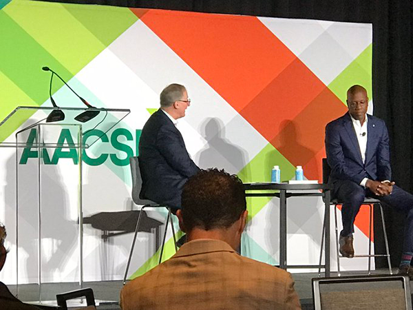 Photo of keynote session "The College Devaluation Crisis," with Jason Wingard and McRae Banks, at AACSB 2023 Deans Conference, taken by Mickey Hepner