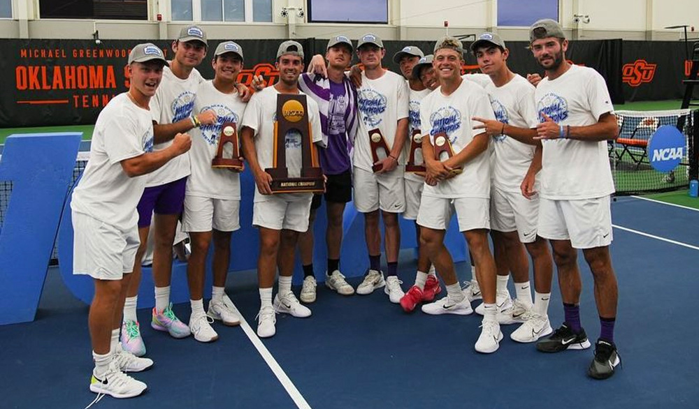 Author Luke Swan stands with his 10 Texas Christian University tennis team teammates, all wearing white shorts, white sneakers, and white NCAA championship T-shirts. One team member holds their large NCAA national championship trophy as others point to it, while four other teammates hold smaller individual trophies.